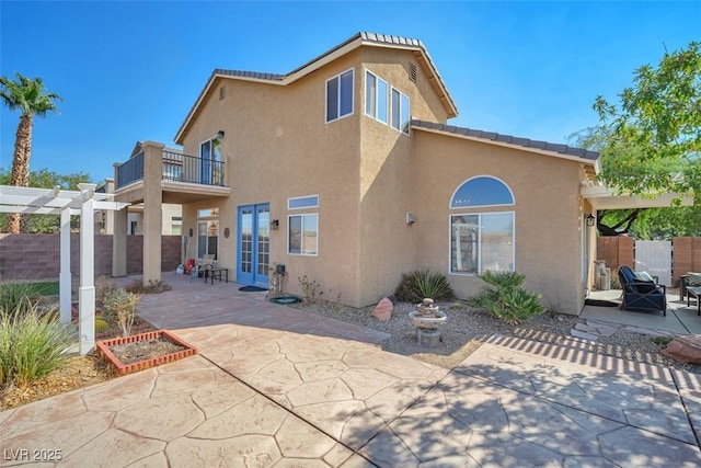 1740 Flores Ln, Henderson, NV 89012 - back of house with a patio, stucco siding, a balcony, french doors, and a pergola