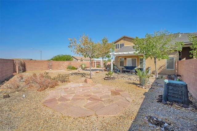 1740 Flores Ln, Henderson, NV 89012 - fenced backyard with a patio