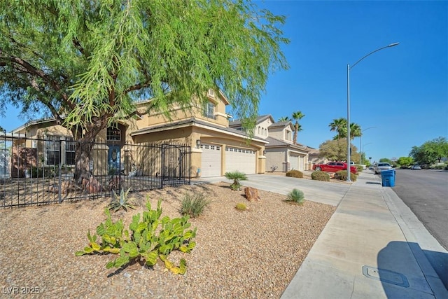 1740 Flores Ln, Henderson, NV 89012 - view of front of property with a garage, stucco siding, and concrete driveway