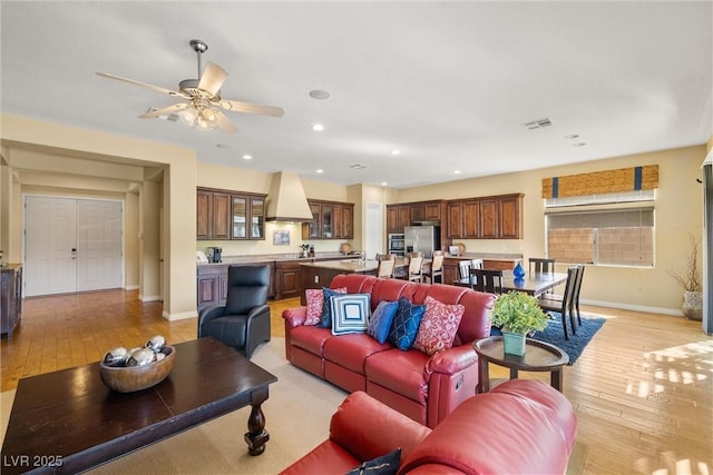 5747 Jaborandi Ave, Pahrump, NV 89061 - living area with light wood-type flooring, baseboards, a ceiling fan, and recessed lighting