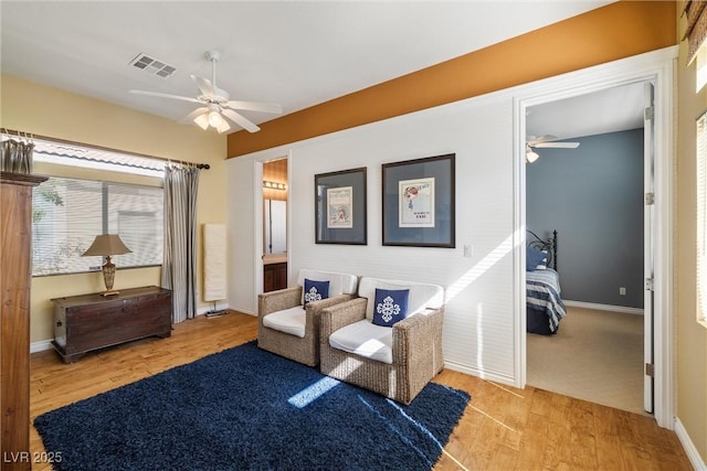5747 Jaborandi Ave, Pahrump, NV 89061 - living area with a ceiling fan, wood finished floors, and baseboards