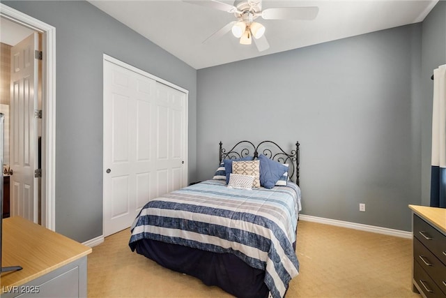 5747 Jaborandi Ave, Pahrump, NV 89061 - bedroom with light colored carpet, baseboards, a closet, and ceiling fan