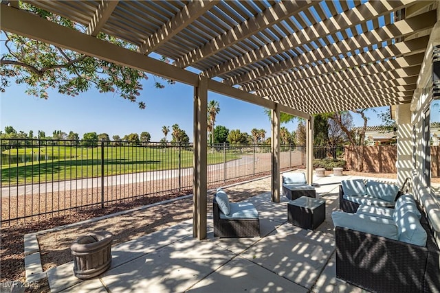 5747 Jaborandi Ave, Pahrump, NV 89061 - fenced backyard with an outdoor hangout area, a patio, and a pergola