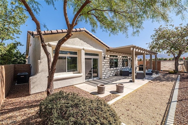5747 Jaborandi Ave, Pahrump, NV 89061 - back of house with central AC, a pergola, a fenced backyard, stucco siding, and a patio
