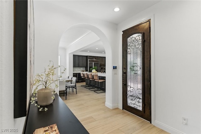11775 Woodbrook Ct, Las Vegas, NV 89141 - entrance foyer with arched walkways, light wood finished floors, recessed lighting, and baseboards