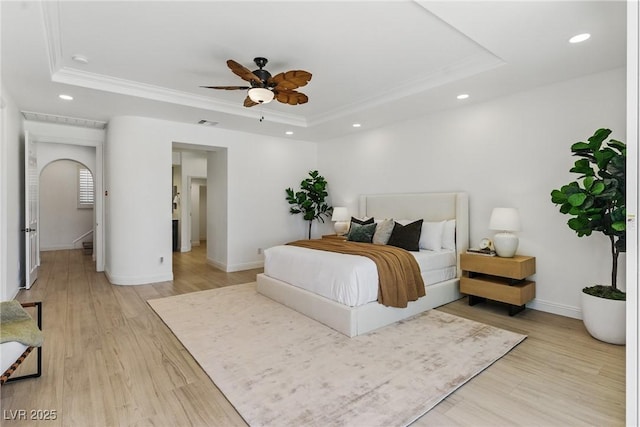 11775 Woodbrook Ct, Las Vegas, NV 89141 - bedroom with a raised ceiling, crown molding, recessed lighting, light wood-style flooring, and baseboards