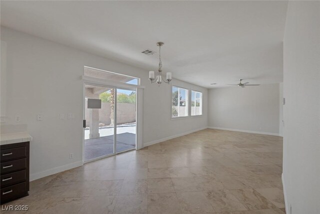 829 Dancing Vines Ave, Las Vegas, NV 89183 - unfurnished dining area with a chandelier, ceiling fan, and baseboards