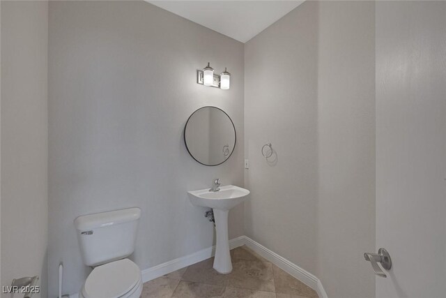 829 Dancing Vines Ave, Las Vegas, NV 89183 - half bathroom featuring toilet, baseboards, and tile patterned floors