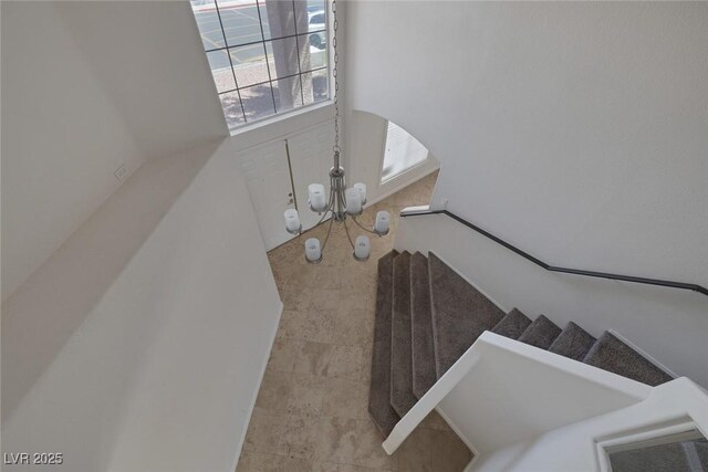 829 Dancing Vines Ave, Las Vegas, NV 89183 - staircase featuring a chandelier