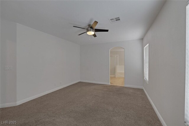 829 Dancing Vines Ave, Las Vegas, NV 89183 - carpeted spare room featuring arched walkways, ceiling fan, and baseboards