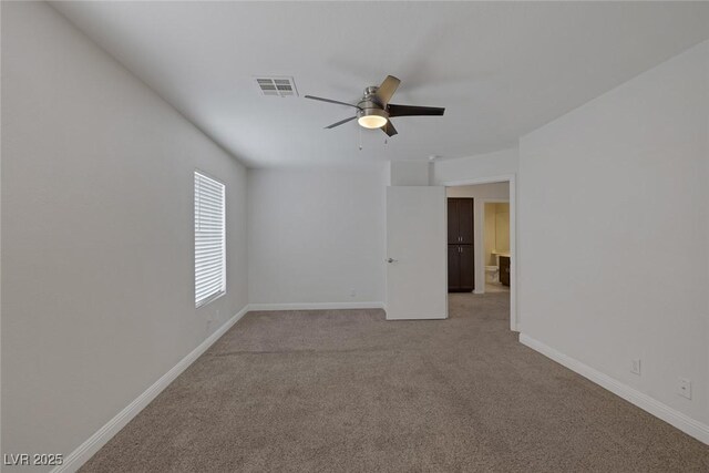 829 Dancing Vines Ave, Las Vegas, NV 89183 - unfurnished room featuring ceiling fan, light carpet, and baseboards