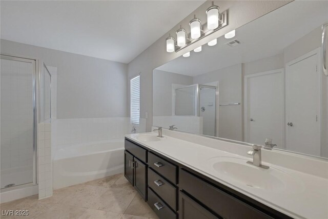 829 Dancing Vines Ave, Las Vegas, NV 89183 - bathroom with a stall shower, double vanity, a garden tub, and tile patterned floors