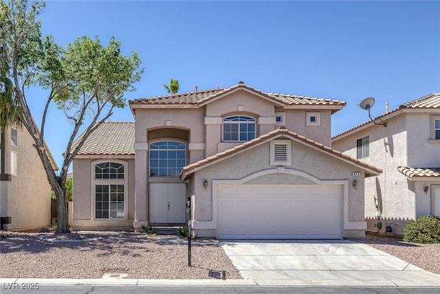 829 Dancing Vines Ave, Las Vegas, NV 89183 - mediterranean / spanish house with driveway, a tiled roof, a garage, and stucco siding