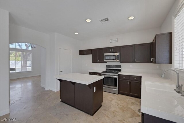 829 Dancing Vines Ave, Las Vegas, NV 89183 - kitchen with appliances with stainless steel finishes, light countertops, dark brown cabinetry, and recessed lighting