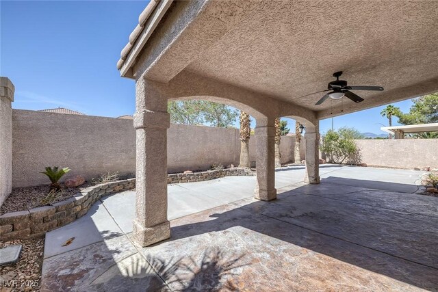 829 Dancing Vines Ave, Las Vegas, NV 89183 - fenced backyard featuring a ceiling fan and a patio