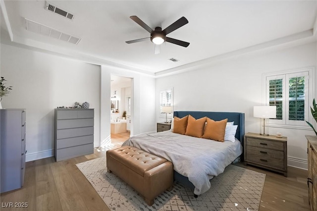 11340 Espadrille Ct, Las Vegas, NV 89138 - bedroom with multiple windows, wood finished floors, ceiling fan, and baseboards