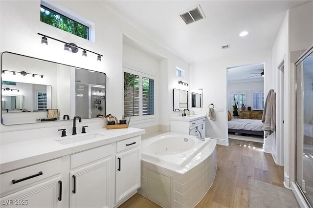 11340 Espadrille Ct, Las Vegas, NV 89138 - full bath with a shower stall, ensuite bathroom, two vanities, a ceiling fan, and a whirlpool tub