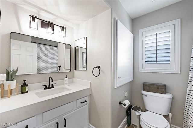11340 Espadrille Ct, Las Vegas, NV 89138 - bathroom with toilet, baseboards, and vanity