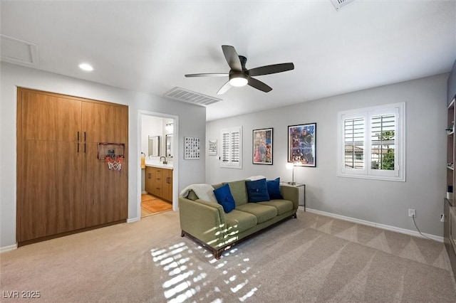 11340 Espadrille Ct, Las Vegas, NV 89138 - living area with light colored carpet, baseboards, ceiling fan, and recessed lighting