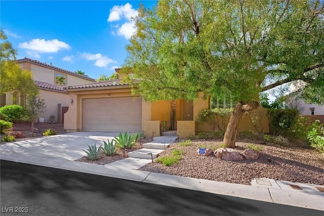 11340 Espadrille Ct, Las Vegas, NV 89138 - view of front facade with stucco siding, a garage, driveway, and a tile roof
