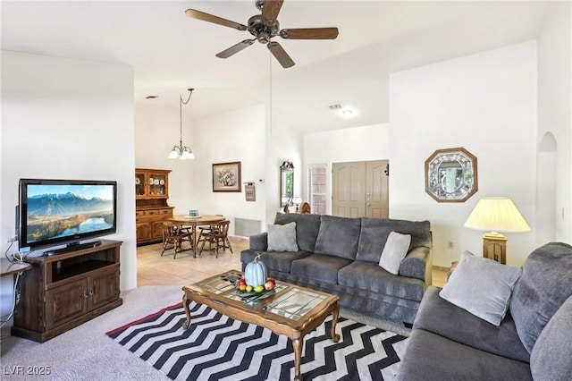 3013 Sungold Dr, Las Vegas, NV 89134 - living area featuring a ceiling fan, high vaulted ceiling, a chandelier, and light carpet