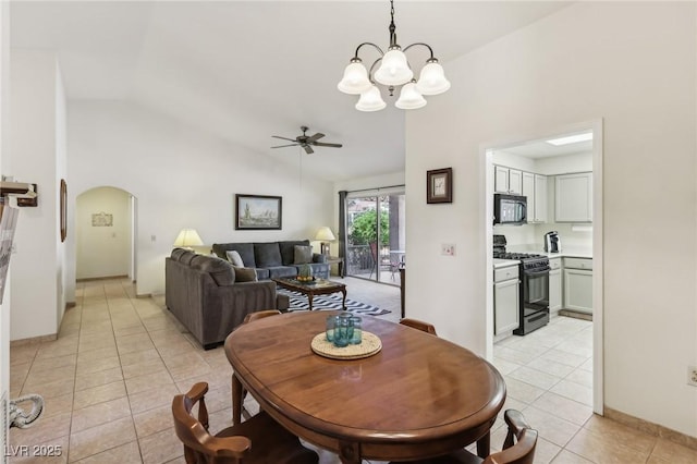 3013 Sungold Dr, Las Vegas, NV 89134 - dining area with arched walkways, light tile patterned floors, a chandelier, ceiling fan, and high vaulted ceiling