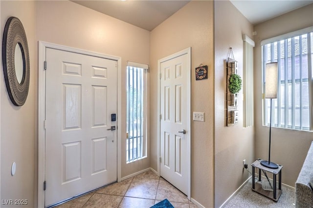 344 Golden Shore Dr, Las Vegas, NV 89123 - foyer entrance with healthy amount of natural light, baseboards, and light tile patterned flooring