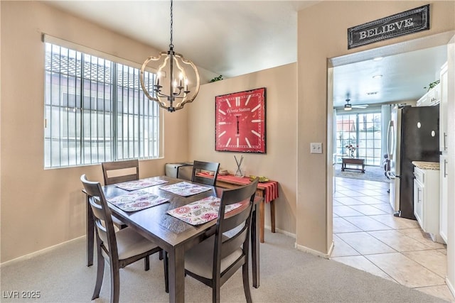 344 Golden Shore Dr, Las Vegas, NV 89123 - dining room with a chandelier, baseboards, and light colored carpet