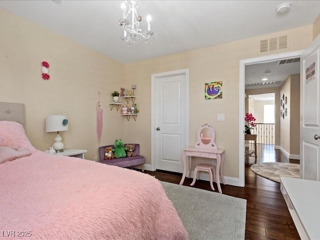 2400 Trissino Ct, Henderson, NV 89044 - bedroom with a chandelier, wood finished floors, and baseboards