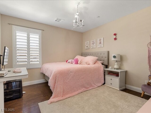 2400 Trissino Ct, Henderson, NV 89044 - bedroom featuring baseboards, wood finished floors, and a chandelier