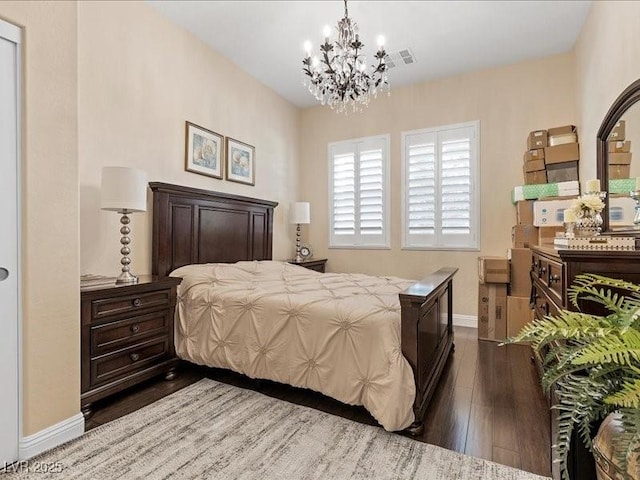 2400 Trissino Ct, Henderson, NV 89044 - bedroom featuring dark wood-style floors, baseboards, and a chandelier