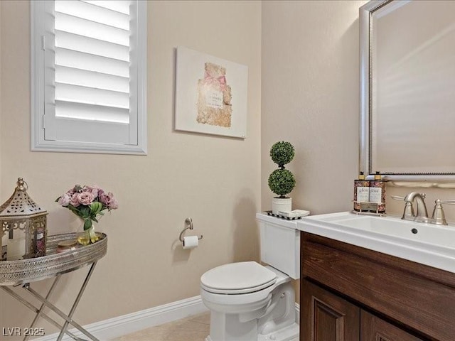 2400 Trissino Ct, Henderson, NV 89044 - bathroom with toilet, vanity, baseboards, and tile patterned floors