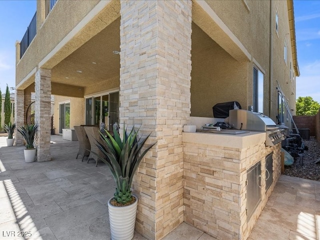 2400 Trissino Ct, Henderson, NV 89044 - view of patio featuring exterior kitchen