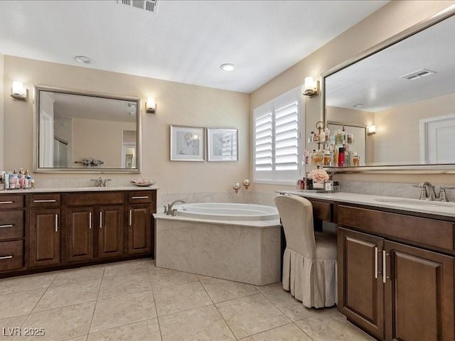2400 Trissino Ct, Henderson, NV 89044 - bathroom featuring two vanities, a bath, and tile patterned floors