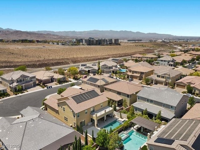 2400 Trissino Ct, Henderson, NV 89044 - aerial view of residential area with a pool and a mountainous background