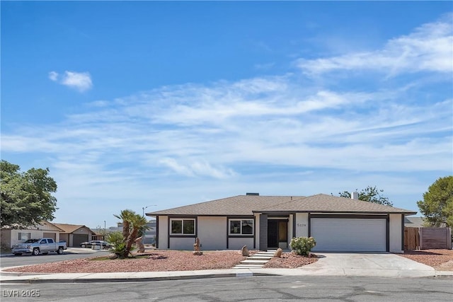 5079 Reno Ct, Las Vegas, NV 89119 - single story home with an attached garage and driveway