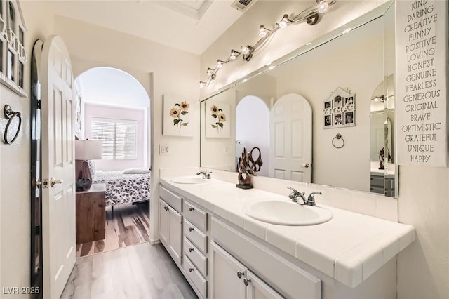 2725 S Nellis Blvd Unit 2084, Las Vegas, NV 89121 - ensuite bathroom with double vanity and wood finished floors