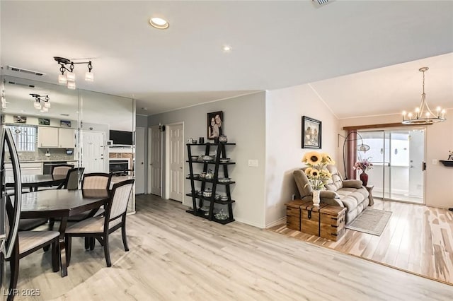 2725 S Nellis Blvd Unit 2084, Las Vegas, NV 89121 - dining area with healthy amount of natural light, light wood-type flooring, baseboards, a chandelier, and ornamental molding