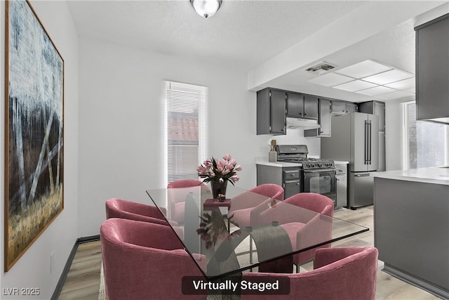 1390 Vegas Valley Dr Unit 26, Las Vegas, NV 89169 - dining space with light wood-type flooring and baseboards