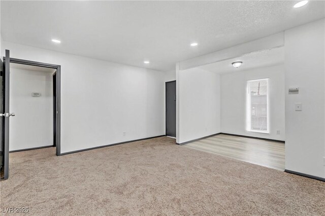1390 Vegas Valley Dr Unit 26, Las Vegas, NV 89169 - empty room with carpet floors, recessed lighting, and baseboards