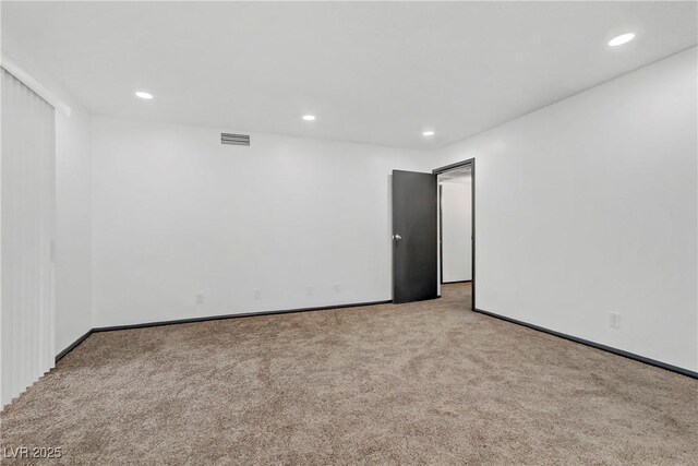 1390 Vegas Valley Dr Unit 26, Las Vegas, NV 89169 - carpeted empty room with recessed lighting and baseboards