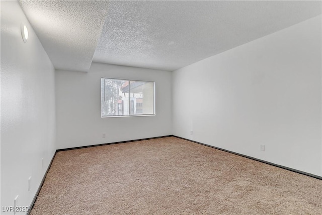1390 Vegas Valley Dr Unit 26, Las Vegas, NV 89169 - carpeted spare room featuring a textured ceiling and baseboards