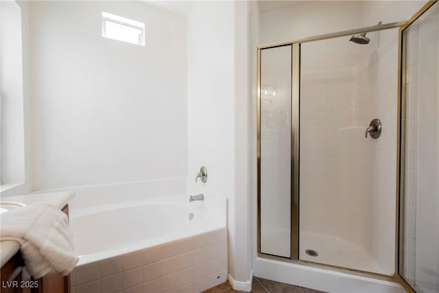 909 Trinity Pond Cir, Henderson, NV 89002 - bathroom featuring a stall shower, vanity, and a garden tub