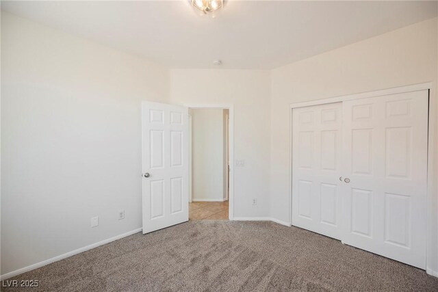 909 Trinity Pond Cir, Henderson, NV 89002 - unfurnished bedroom featuring carpet, baseboards, and a closet