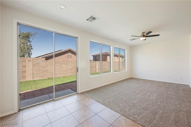 909 Trinity Pond Cir, Henderson, NV 89002 - carpeted empty room with a ceiling fan, baseboards, and tile patterned floors