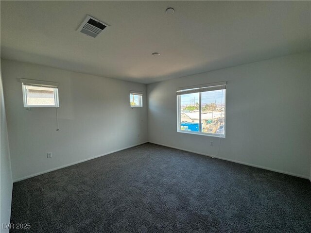 5175 Capucina St Lot 5, Las Vegas, NV 89122 - unfurnished room with dark carpet and baseboards