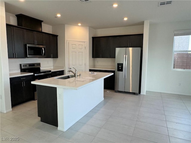 5175 Capucina St Lot 5, Las Vegas, NV 89122 - kitchen featuring stainless steel appliances, a sink, a center island with sink, recessed lighting, and light countertops