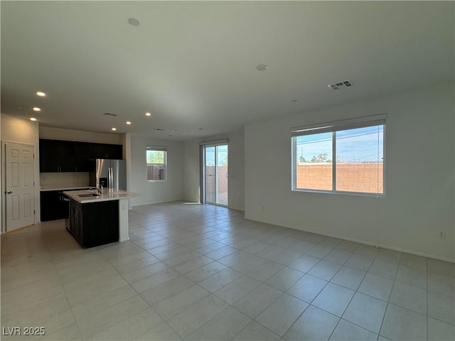 5175 Capucina St Lot 5, Las Vegas, NV 89122 - unfurnished living room featuring a sink, light tile patterned floors, recessed lighting, and baseboards