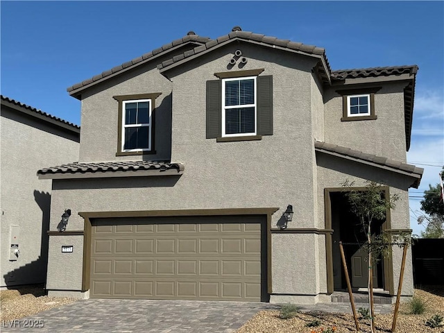 5175 Capucina St Lot 5, Las Vegas, NV 89122 - view of front facade with an attached garage, stucco siding, a tiled roof, and driveway