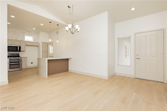 10309 Georgetown Pl, Las Vegas, NV 89134 - kitchen featuring stainless steel appliances, light wood finished floors, a chandelier, pendant lighting, and light countertops